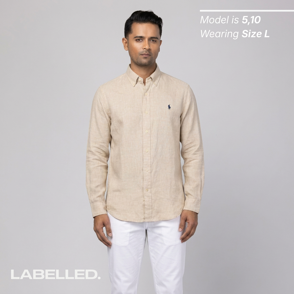 Man wearing a vintage Ralph Lauren beige shirt with a logo on a gray background